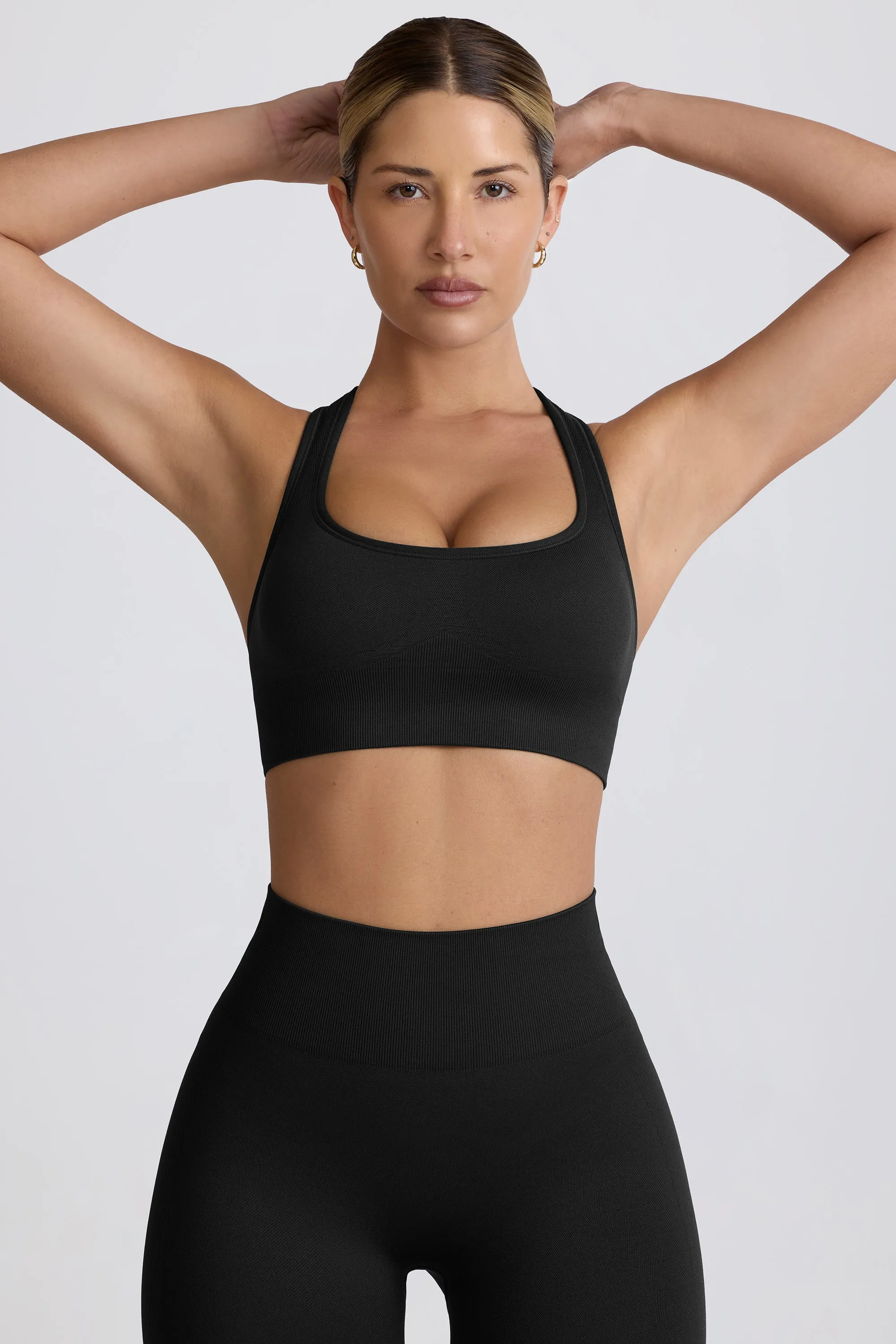 Super Sculpt Seamless T-Back Sports Bra in Black